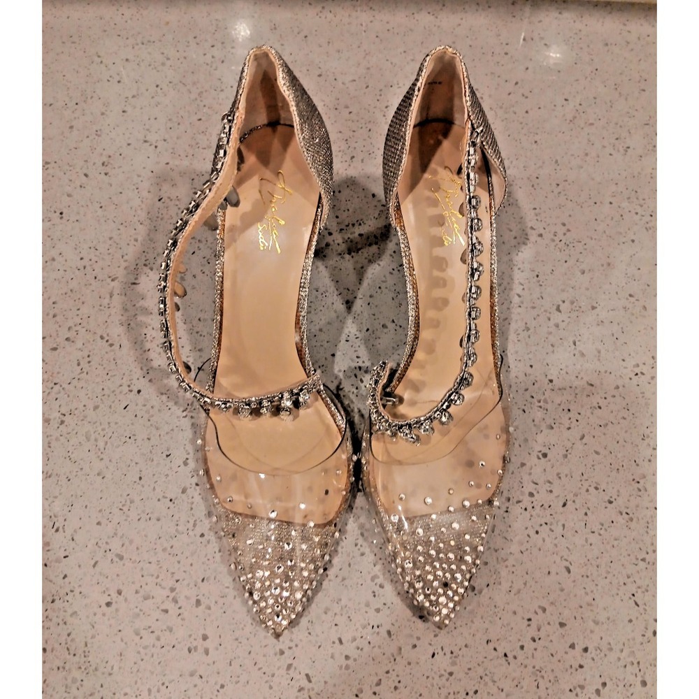 Thalia Sodi Kassidy pumps, with clear panels, strap with dangling rhinestones.